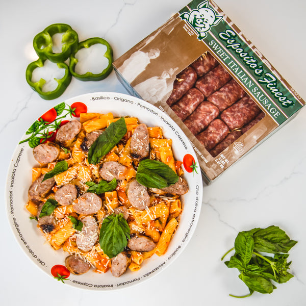 A box of Sweet Italian Sausage and a bowl of pasta with sausage slices.